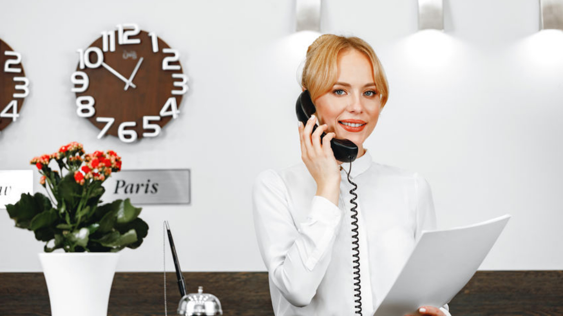 hotel receptionist answering phone call