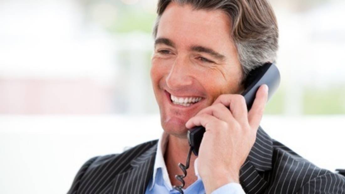 10131740 - portrait of a smiling businessman on phone
