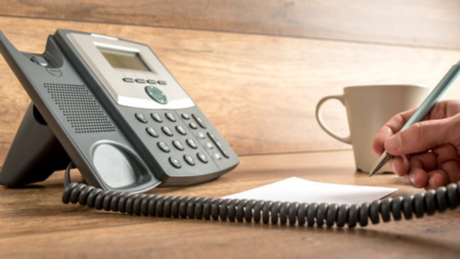 man using his business phone system