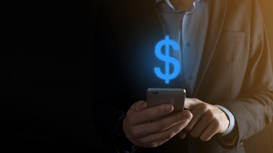 Business owner getting the advantages of SMS Marketing in his payment process success